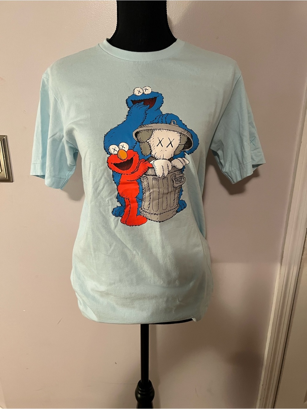 KAWS x Uniqlo x Sesame Street Companion Trash Can Tee Light Blue